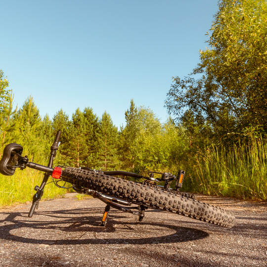 Bicycle lies on rural road
